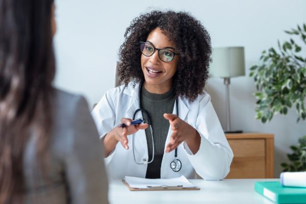 Doctor explaining report to patient