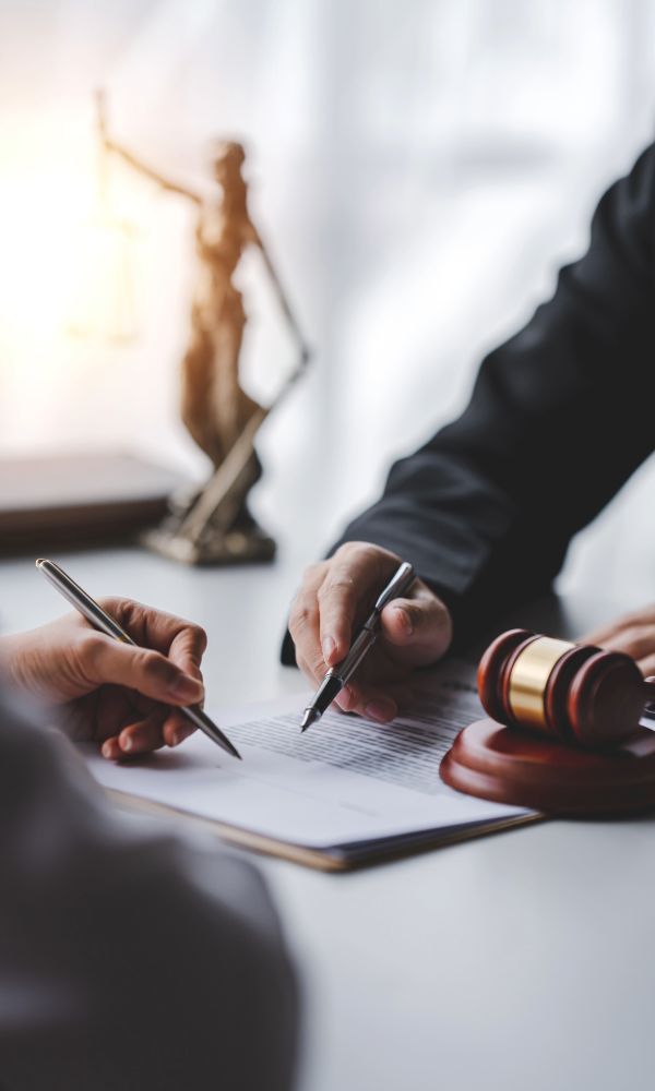 Judge writing notes with a gavel nearby - legal professionals need strong online visibility