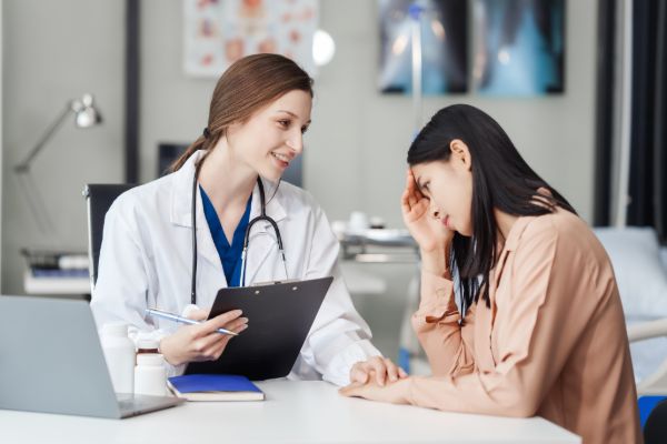 therapist discussing mental health concerns with client