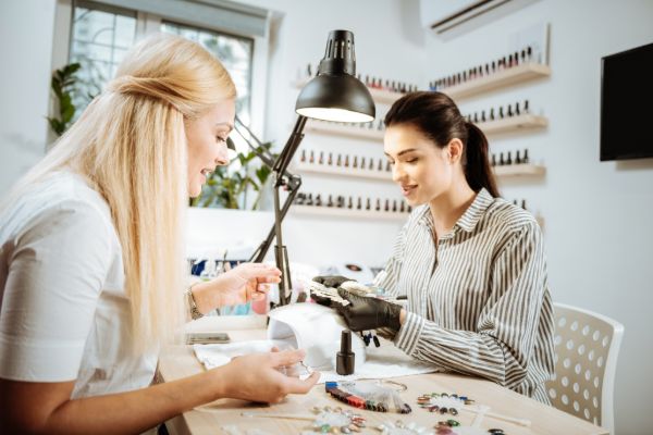 Client receiving a professional manicure at a nail salon