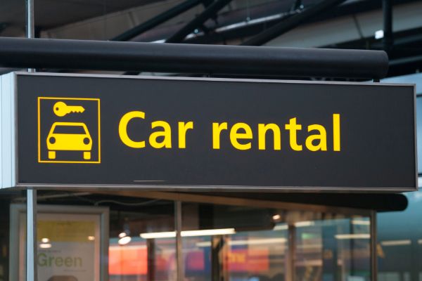 Airport car rental sign board at terminal