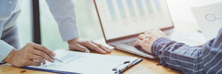 bookkeeping consultation with client discussing financial reports