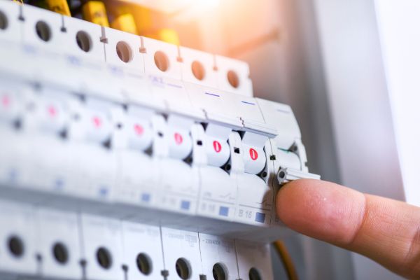 close up of circuit breaker panel being switched