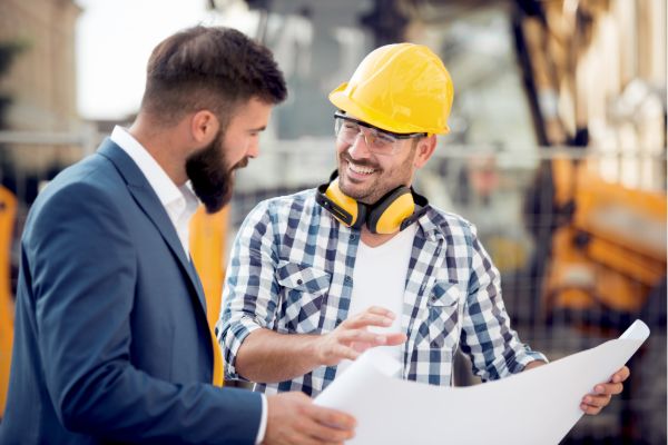 Contractor discussing construction plans with a client