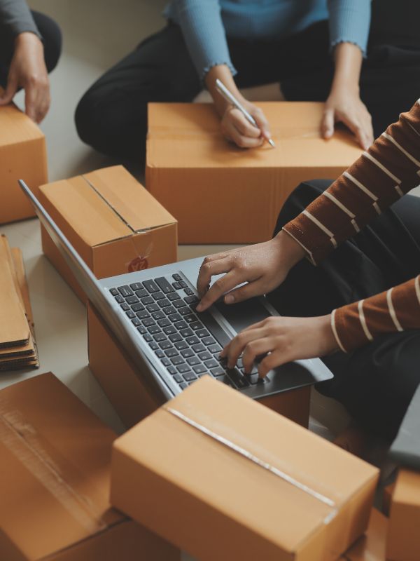 Ecommerce team packing orders and managing online store shipping process