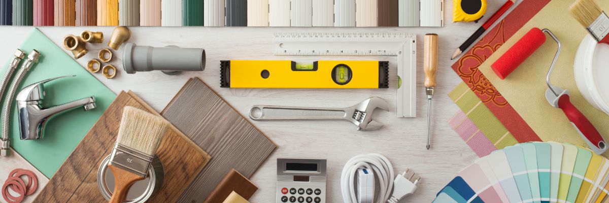 Various home improvement tools and materials arranged for renovation planning