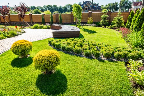 Beautiful home exterior garden landscaping design with lawn and plants