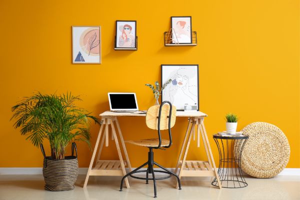 Modern interior room with freshly painted yellow wall and decor setup