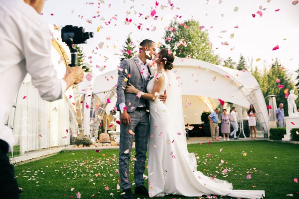 Wedding couple during ceremony captured by photographer
