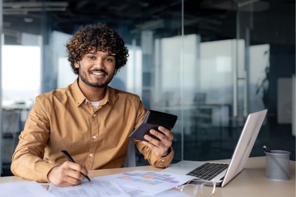 Accountant reviewing financial data on laptop