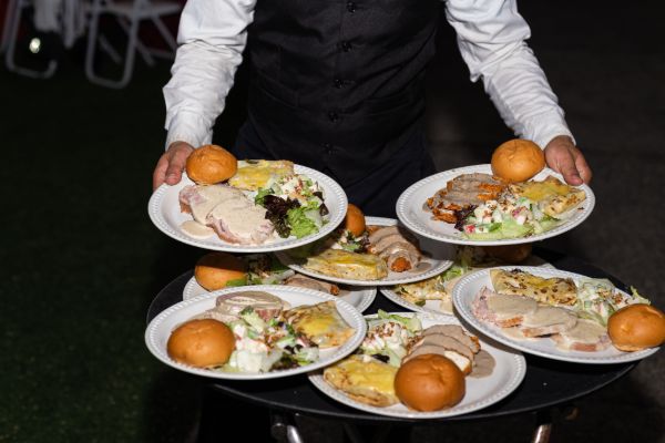 Catering service staff serving food during an event
