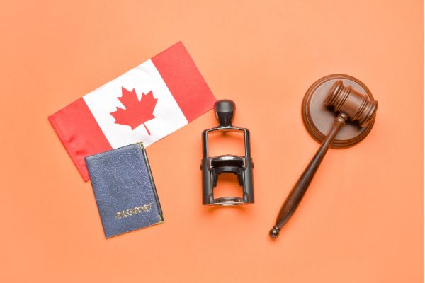 Canada immigration law concept with passport, legal gavel, and national flag