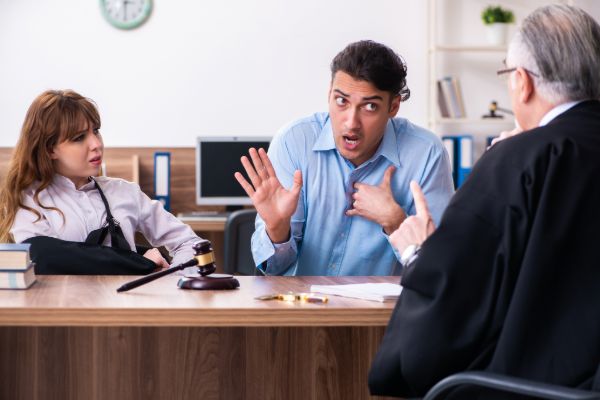 Domestic violence attorney consultation with clients discussing legal options