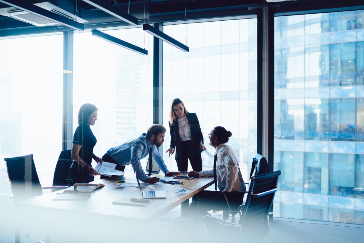 Employment law professionals meeting in a modern office conference room