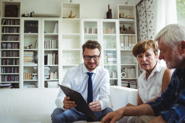 Estate planning attorney meeting with clients to discuss future planning
