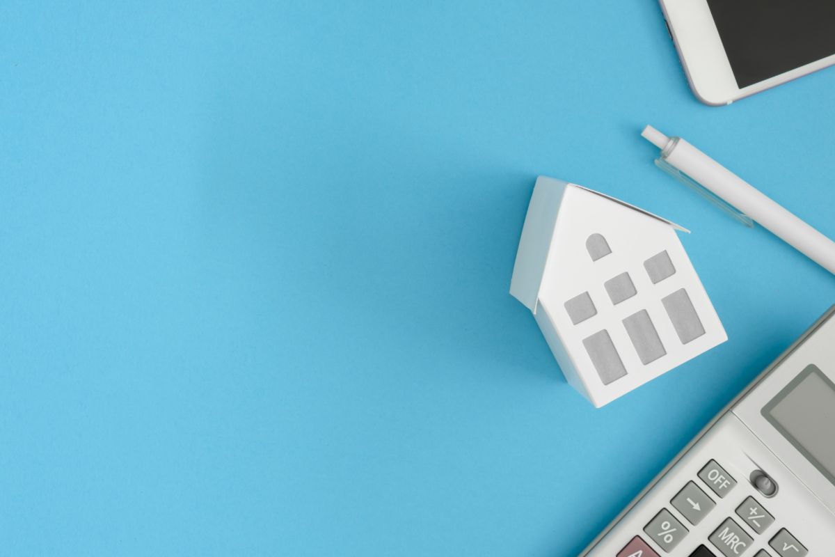 Estate planning concept with home, financial documents, and personal assets