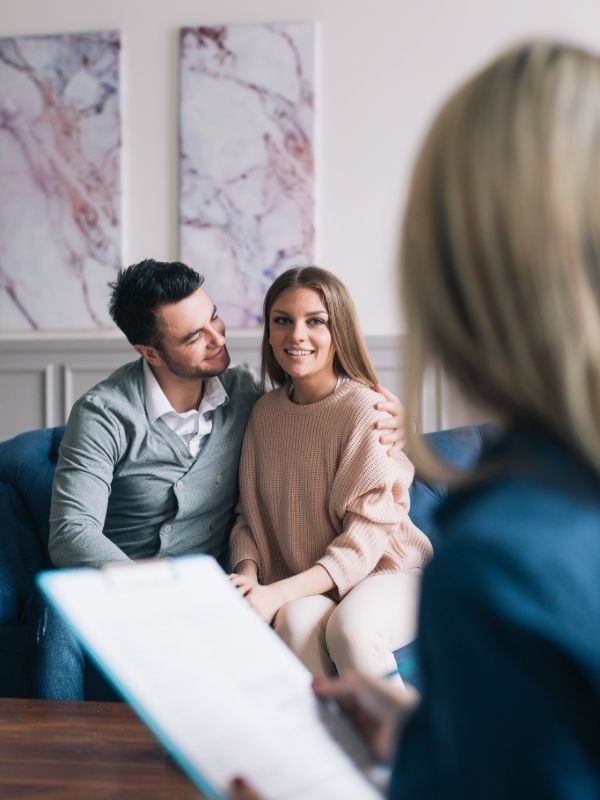Family law attorney consulting with a couple about legal matters