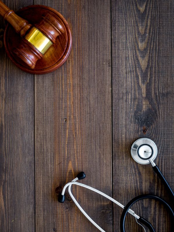 Medical negligence legal services with a gavel and stethoscope.