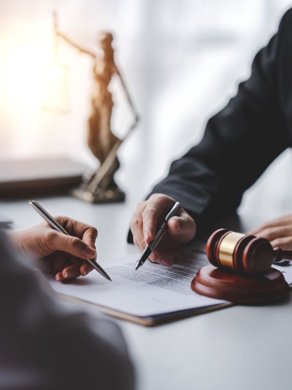 Patent attorney discussing a patent application with a client