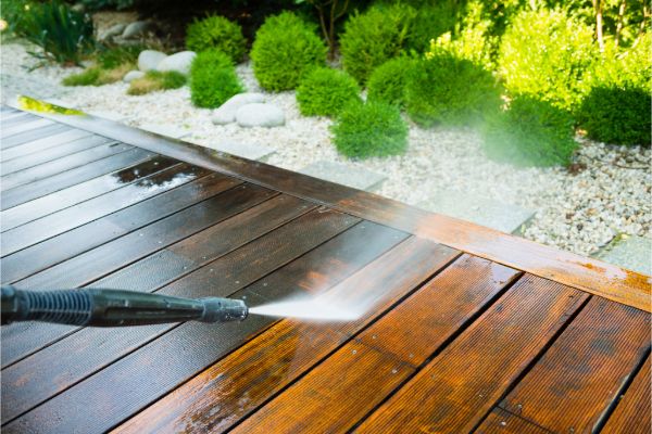 Pressure washing a wooden deck